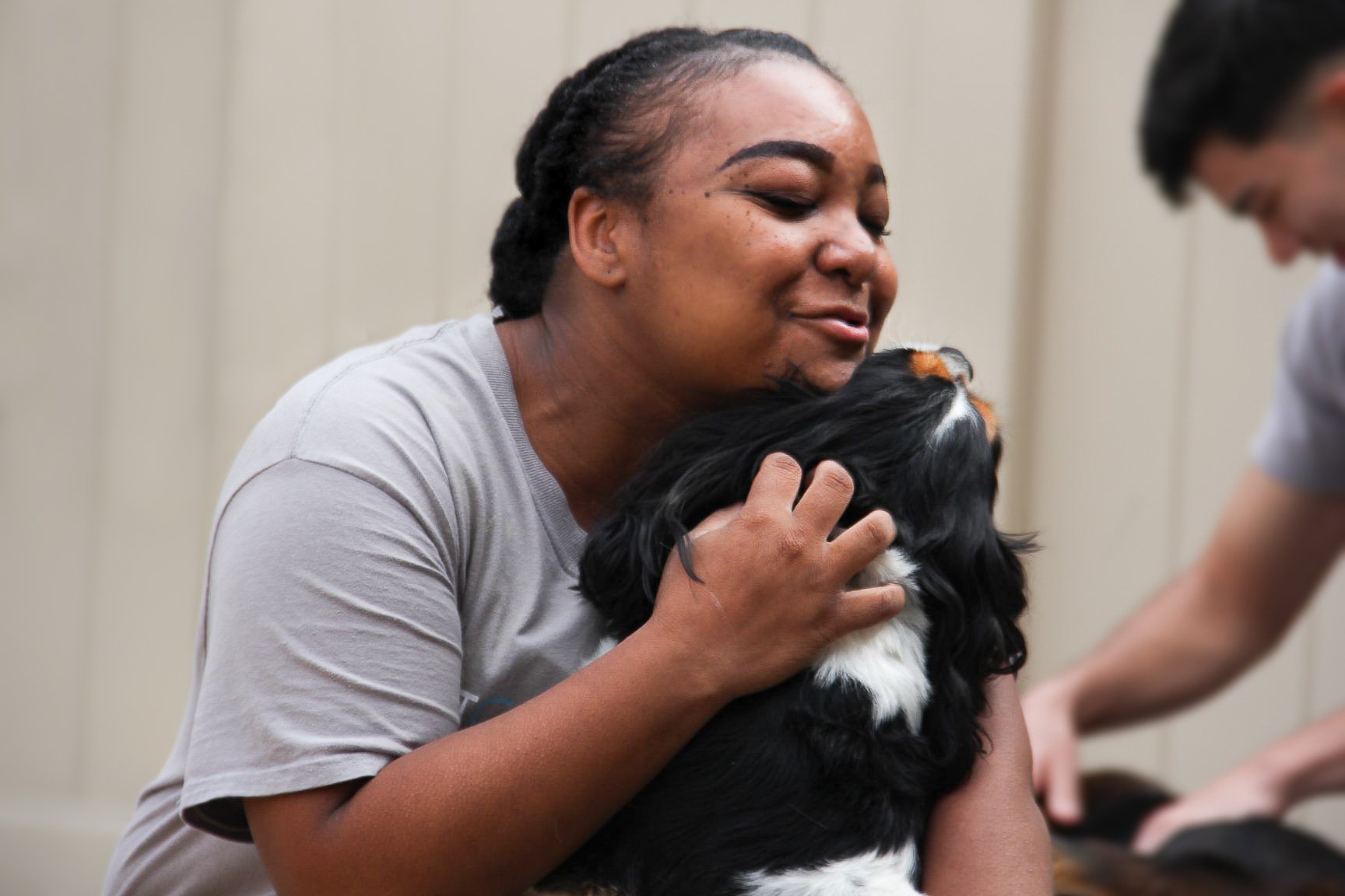A dog resting between activities during a boarding stay booked from Garfield Park